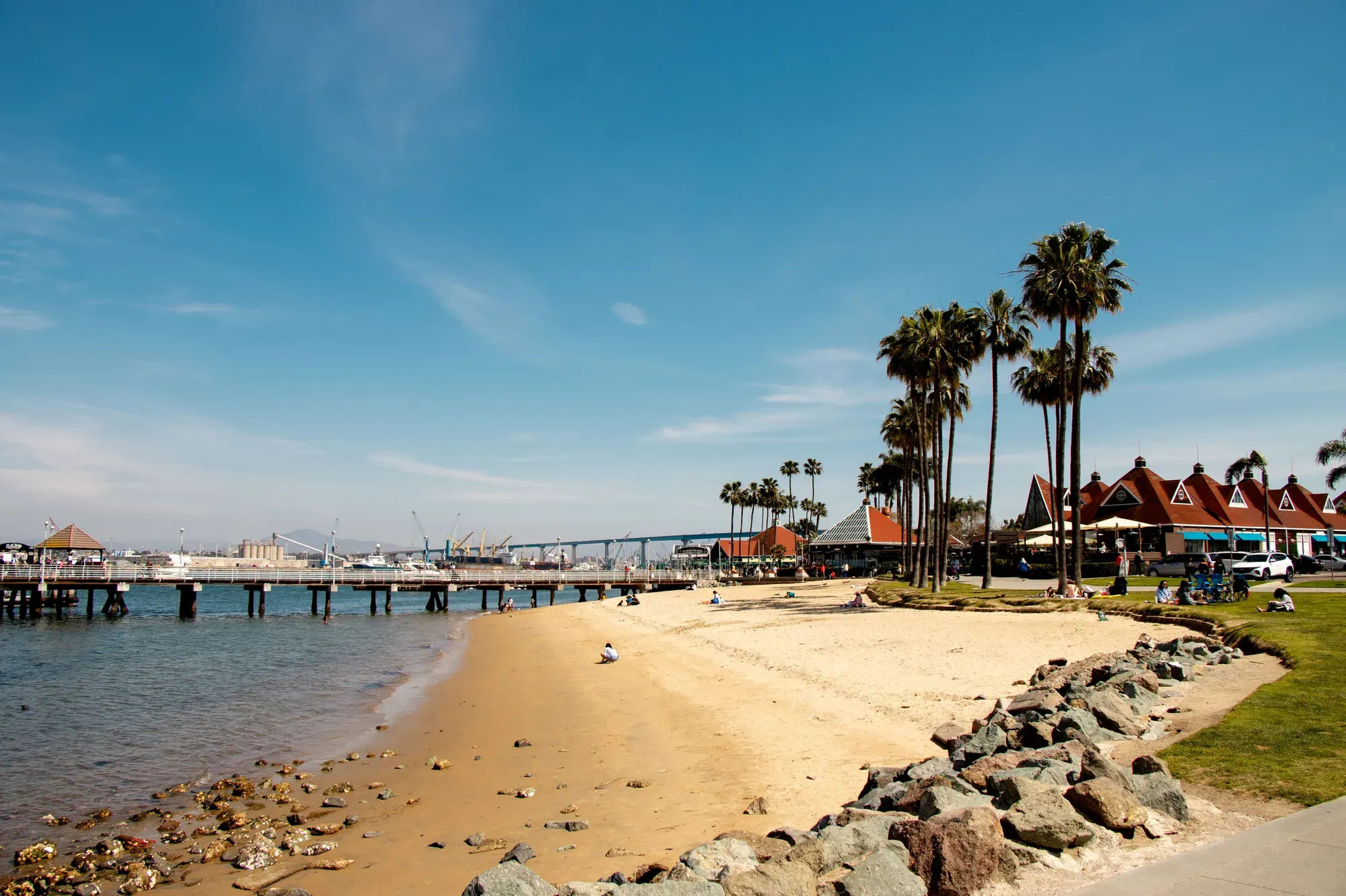 The beach at Coronado's Ferry Landing, with the Coronado Bridge and the bay behind it