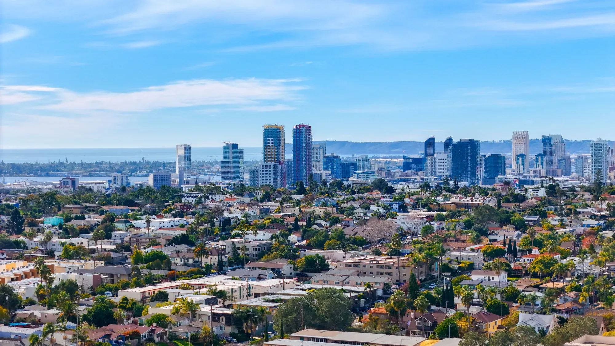 The view from Golden Hill's bluff over rooftops toward the downtown San Diego skyline and the bay